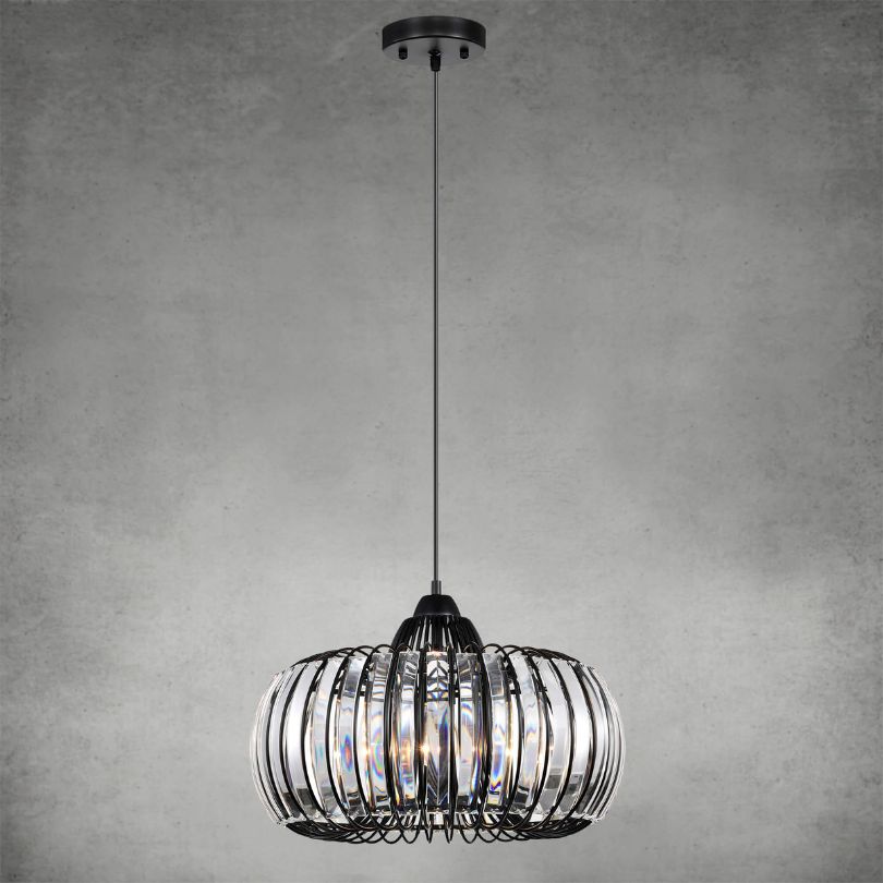 Black crystal chandelier installed in a cozy kitchen, illuminating the space with warm, inviting light.