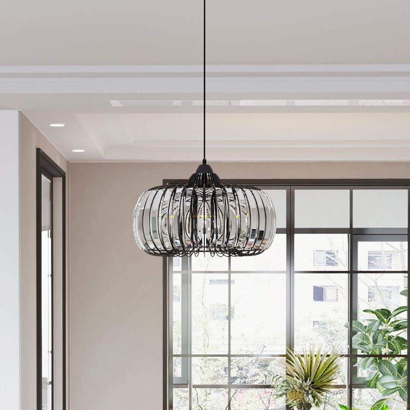 Black crystal chandelier installed in a cozy kitchen, illuminating the space with warm, inviting light.
