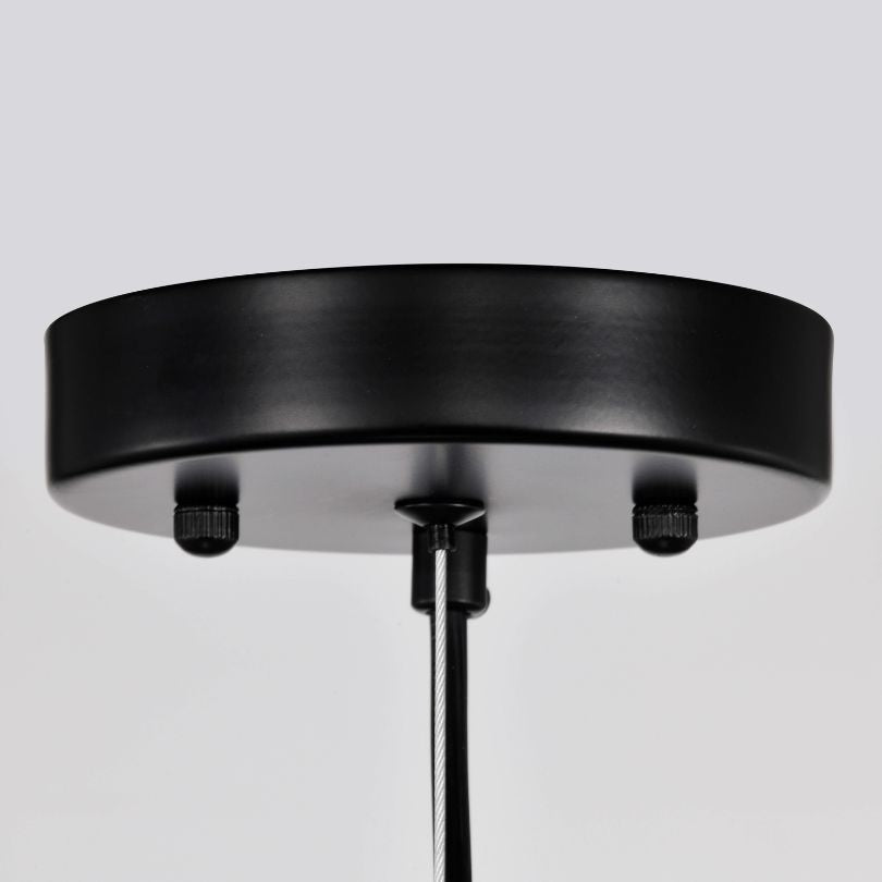 Elegant modern black crystal chandelier showcasing its adjustable height feature in a stylish dining room setting.