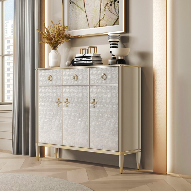 Close-up of the gold metal frame on the modern shoe cabinet, highlighting its elegant design.