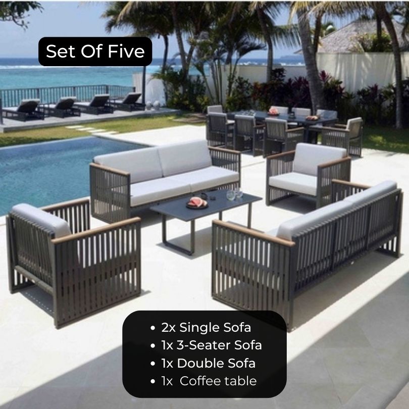 Lounge chair and sofa from the outdoor metal furniture set with armrests on a sunny patio