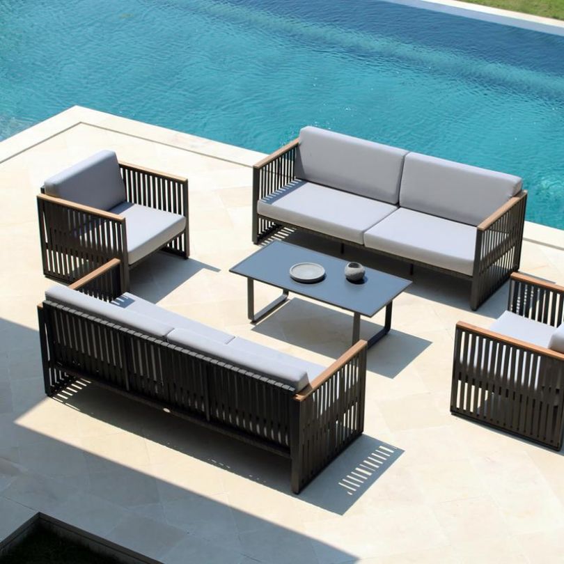 Modern patio set with metal frame and comfortable armrests, perfect for garden relaxation