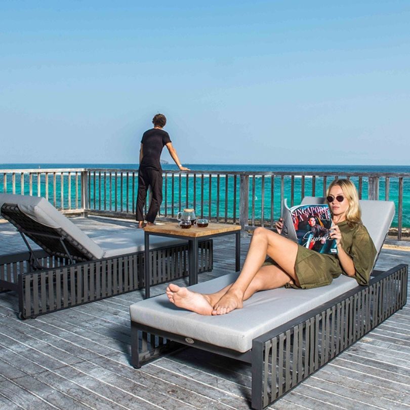 Modern patio set with metal frame and comfortable armrests, perfect for garden relaxation