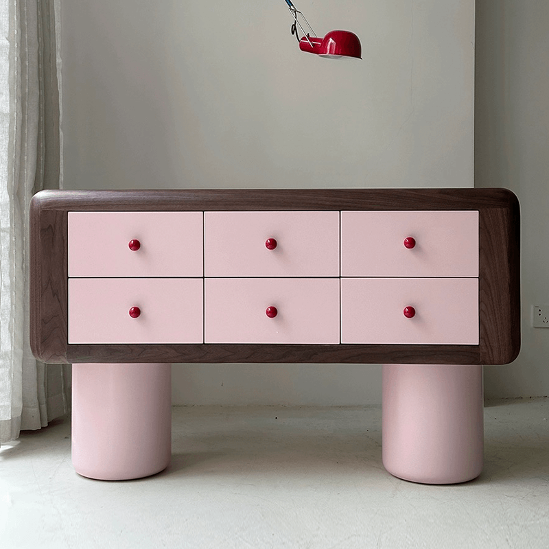 Front view of the modern pink dresser highlighting its sleek drawer layout