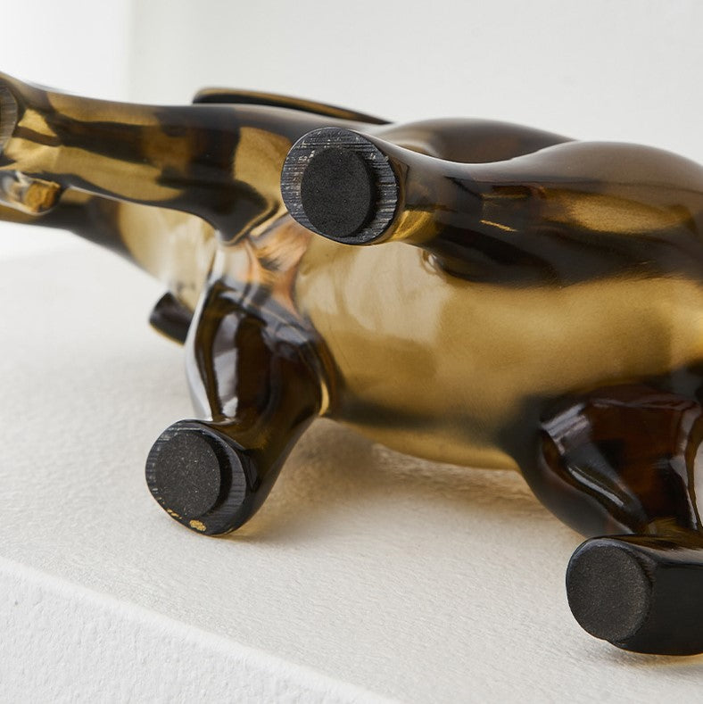 Sleek resin animal figurine on a modern desk, adding elegance to the workspace.