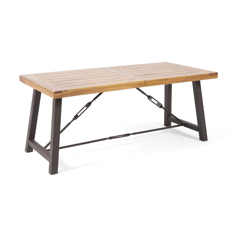 Rustic Charm Industrial Outdoor Dining Table set up on a sunny patio, showcasing its spacious surface for dining.