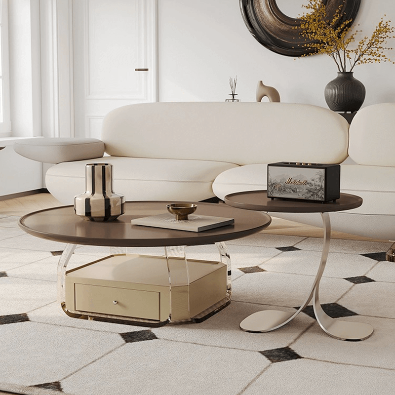 Angled view of round coffee table and side table in brown finish, styled in modern living room