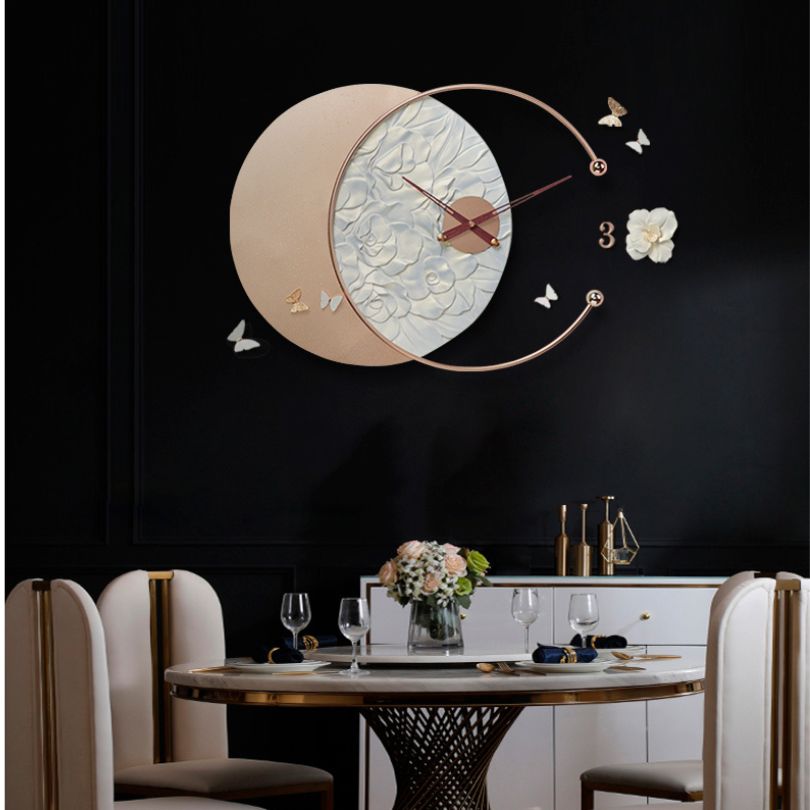 Elegant butterfly design wall clock highlighting the combination of resin and wrought iron materials.