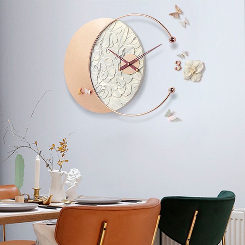 Close-up view of the decorative clock showcasing the intricate butterfly design and resin details.