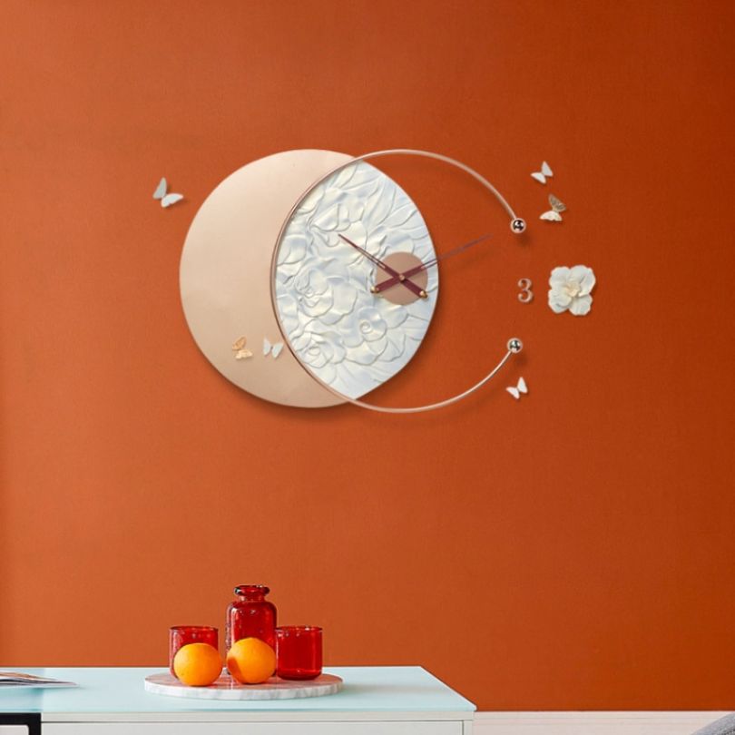 Modern wall clock with quartz movement displayed in a stylish living room setting.