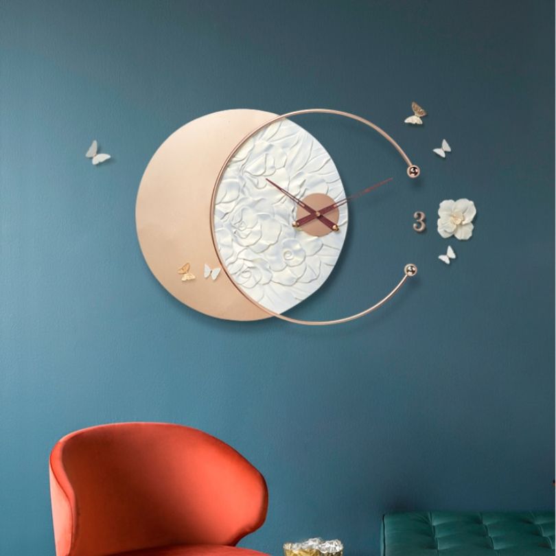 Elegant butterfly design wall clock highlighting the combination of resin and wrought iron materials.