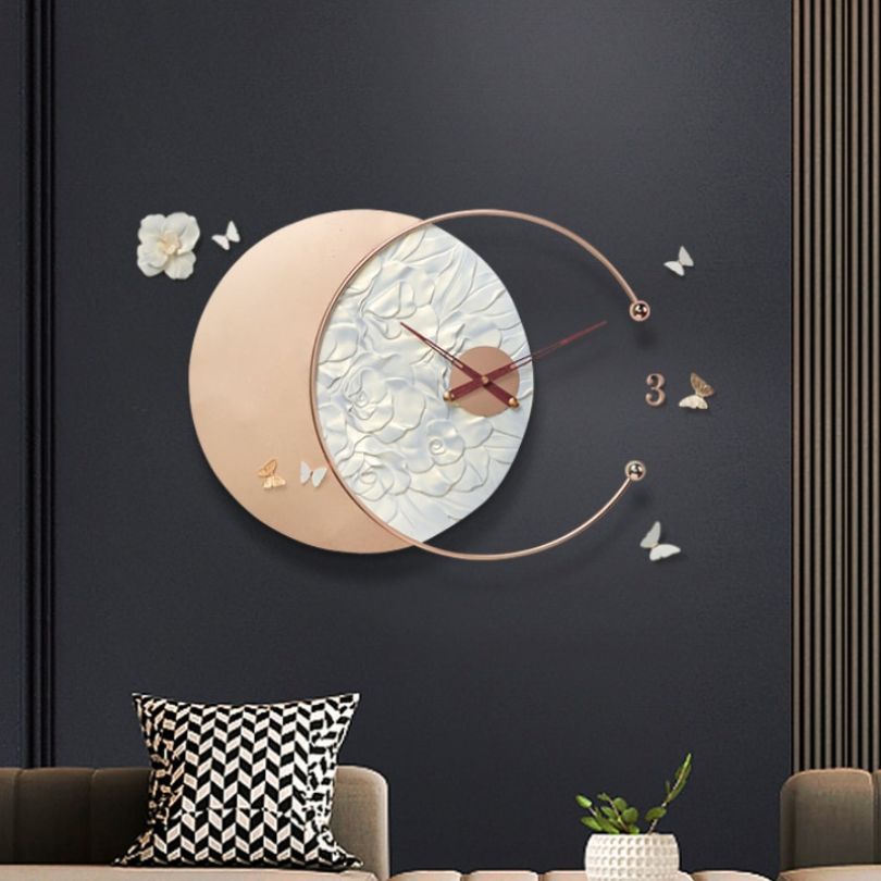 Close-up view of the decorative clock showcasing the intricate butterfly design and resin details.