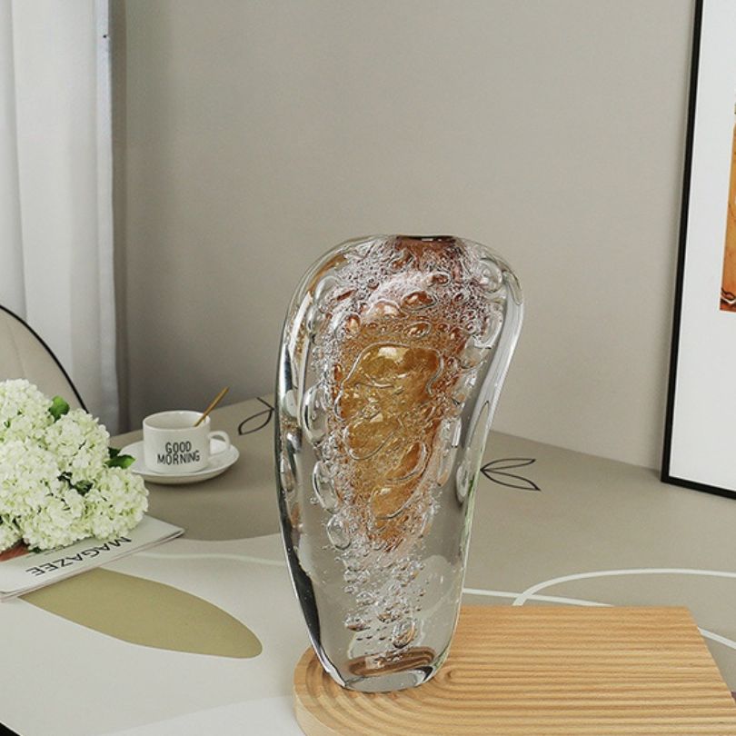 Abstract shape of the silver bubble vase in a bright room, enhancing the overall design aesthetic.