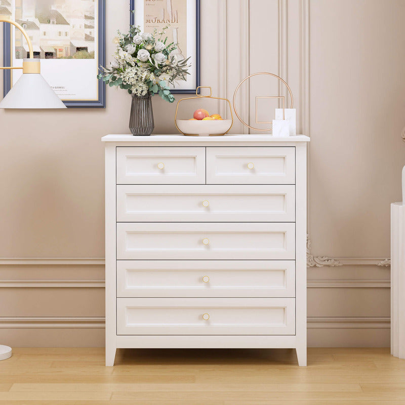Close-up view of the elegant round handles on the antique white 6-drawer chest, highlighting its farmhouse style.