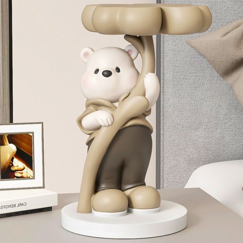 Colorful bear sculpture showcasing pink, brown, and blue details in a modern living room setting.