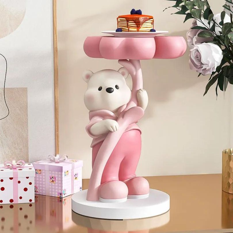 Colorful bear sculpture showcasing pink, brown, and blue details in a modern living room setting.