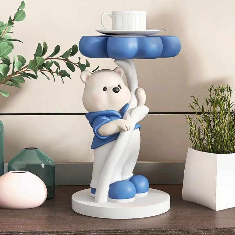 Unique bear sculpture with tray top displayed elegantly on a dining table.