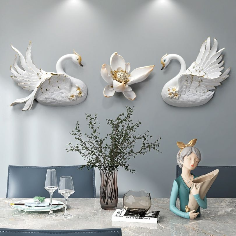 Stylish swan wall art in a bright living room setting.