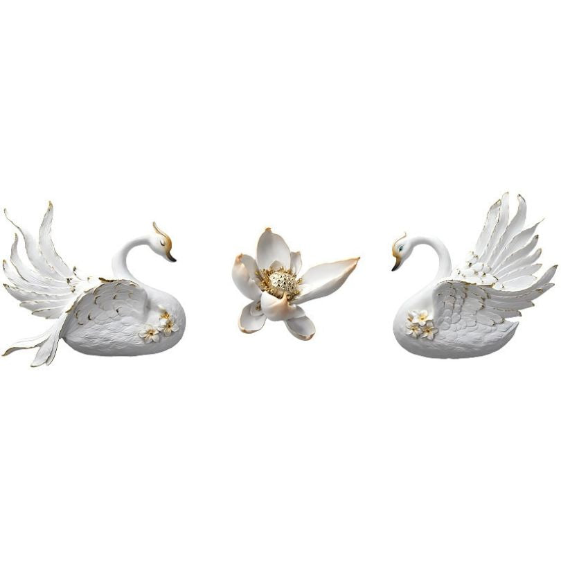 Elegant swan figurine wall decoration hanging above a couch.