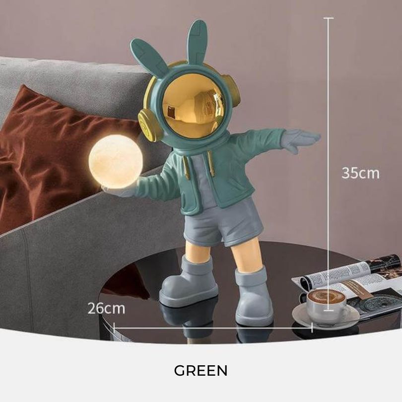 Astronaut statue with light displayed on a modern office desk, creating a calming atmosphere.