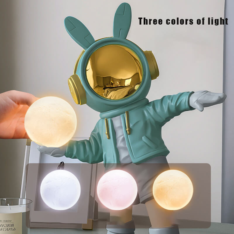 Illuminated astronaut statue in a cozy childrens room, glowing softly.