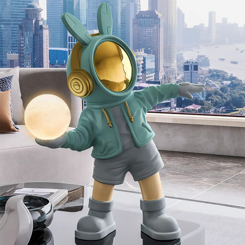Illuminated astronaut statue in a cozy children's room, glowing softly.