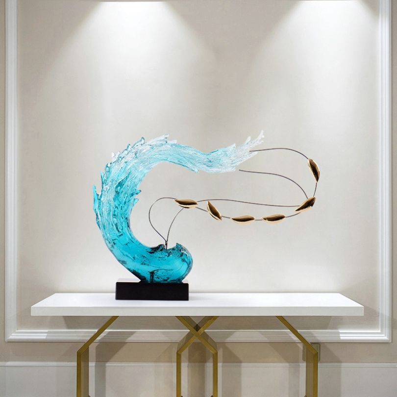 Serene Blue Wave Resin Sculpture displayed in a modern living room, highlighting its calming blue color and elegant design.