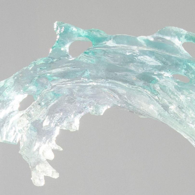 Close-up of the Serene Blue Wave Resin Sculpture, showcasing the intricate details and luxurious gold accents.