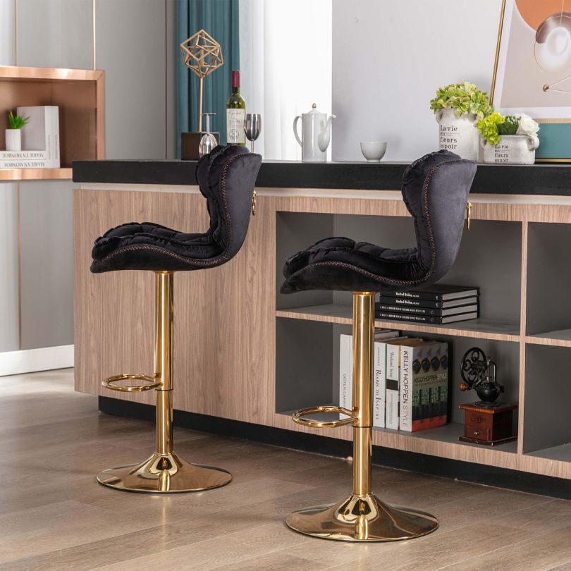 Close-up view of luxury bar stools with velvet upholstery showcasing tufted design.