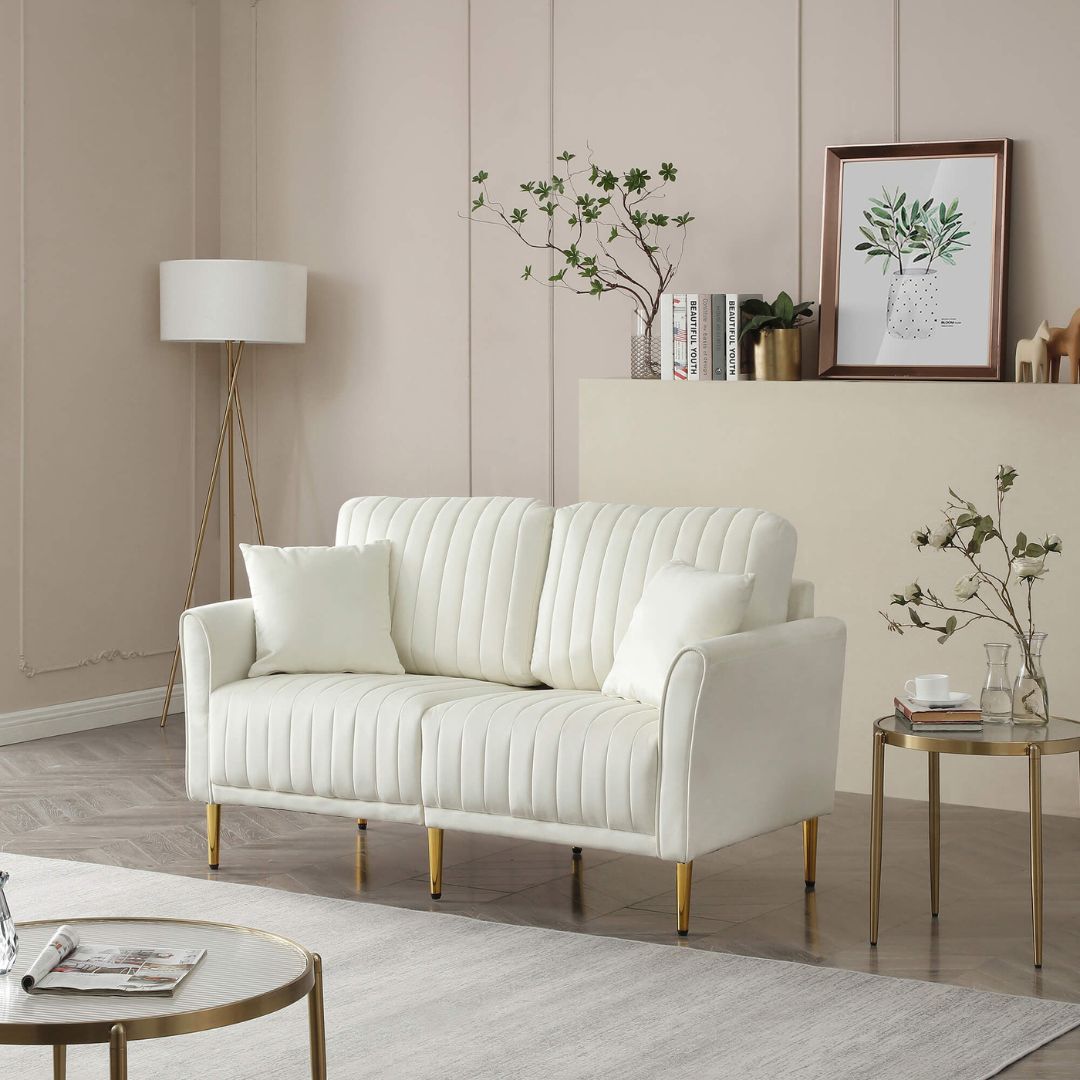 Front view of the luxurious cream velvet loveseat sofa in a modern living room setting.