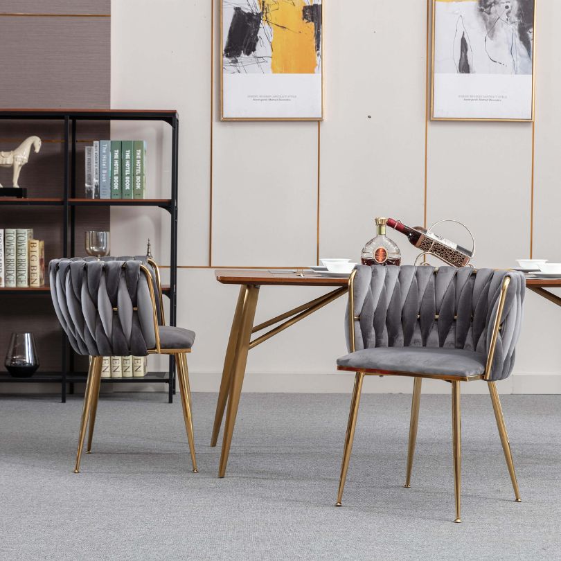 Side view of the luxurious velvet dining chair showcasing its golden legs.