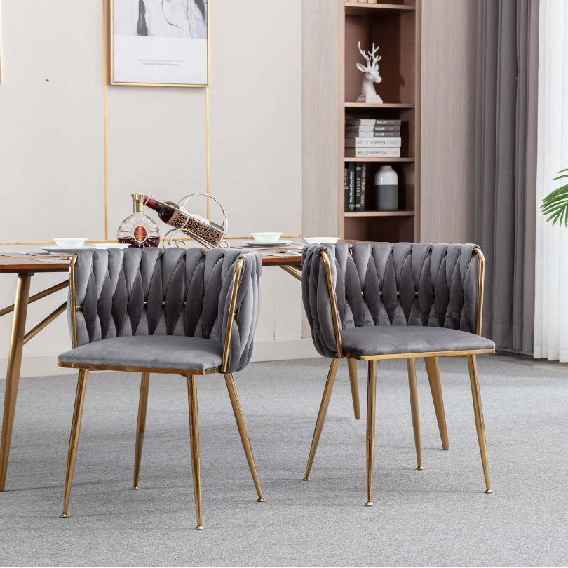 Side view of the luxurious velvet dining chair showcasing its golden legs.