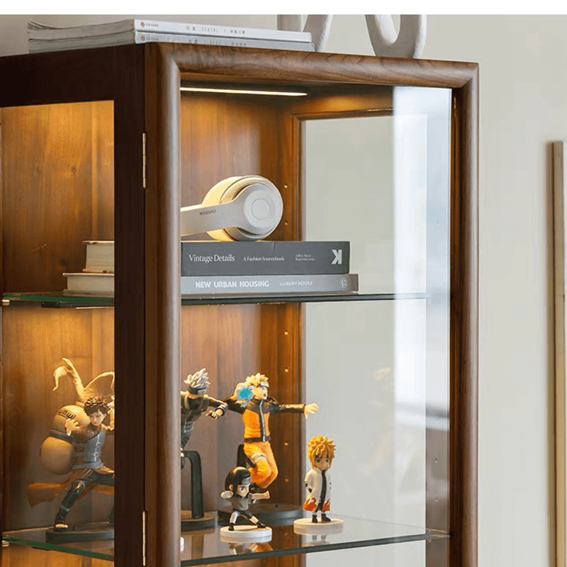 Front view of walnut cabinet showcasing glass shelves with decorative items