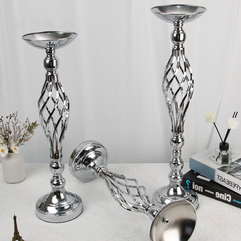 Close-up of the metal candle holder showcasing its modern design in gold finish.