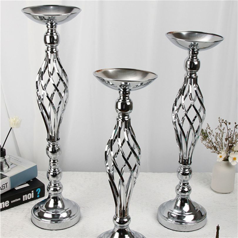 Close-up of the metal candle holder showcasing its modern design in gold finish.