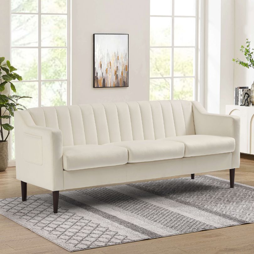 Elegant White Chesterfield 3-Seater Velvet Sofa in a modern living room setting, highlighting side pockets.