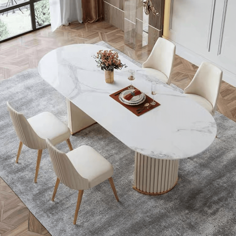 Sleek oval marble dining table showcasing its smooth surface and rounded corners.