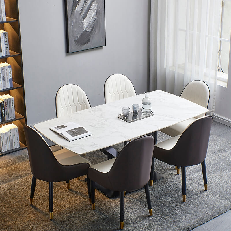 Elegant white sintered stone dining table with black base and chairs
