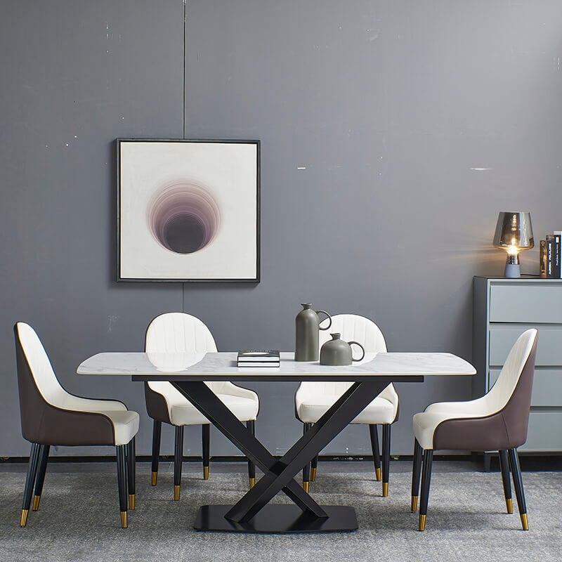 Elegant white sintered stone dining table with black base and chairs