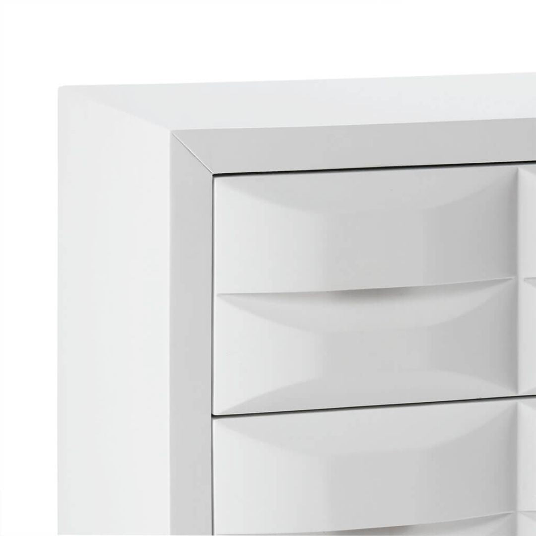 Angled front view of modern chest with white gloss finish and gold metal legs, showing all 3 drawers