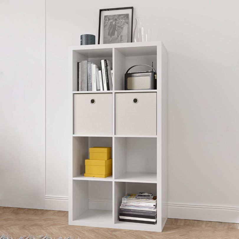 Sleek white cube bookshelf in a modern home office setting, showcasing books and decor.