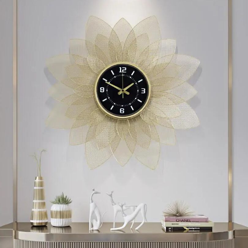 Wrought iron sunflower wall clock hanging in a modern living room.