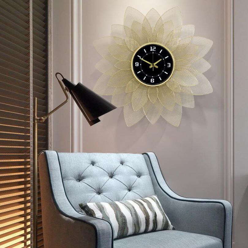 Wrought iron sunflower wall clock hanging in a modern living room.