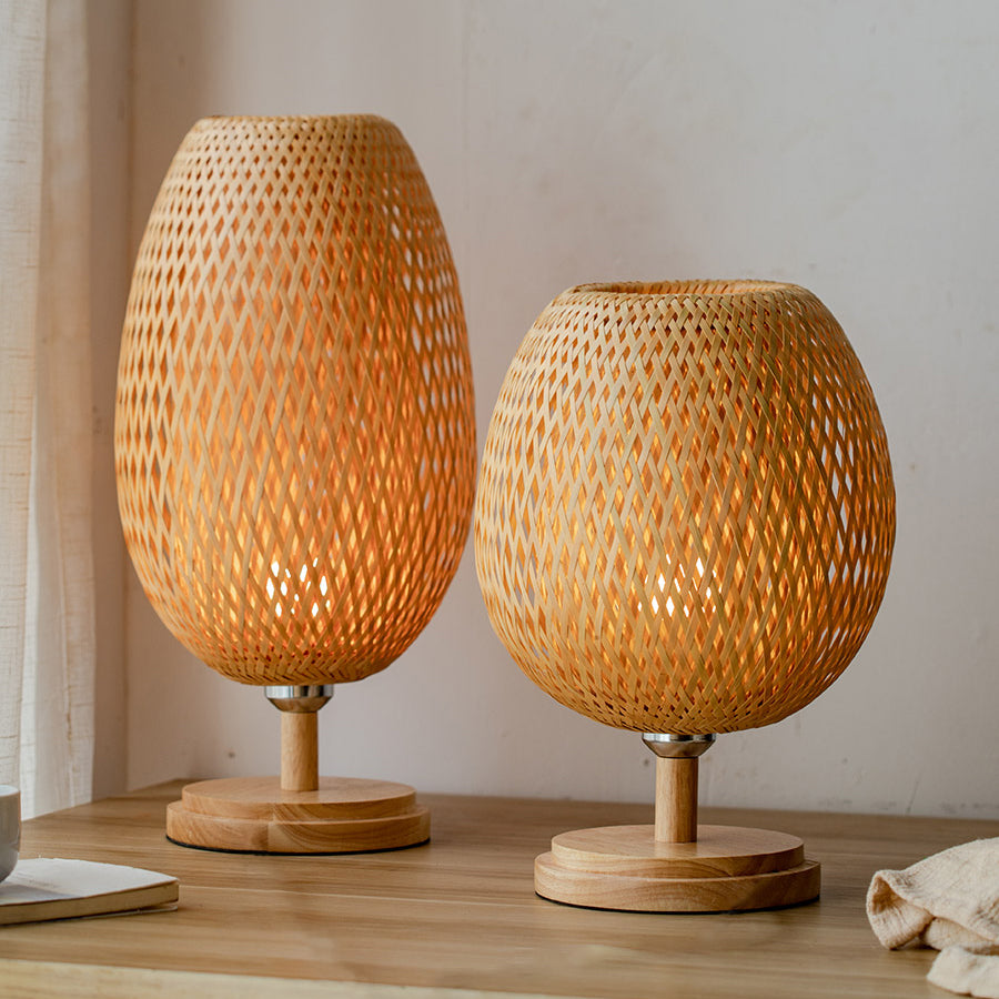 Side view of rustic bamboo table lamp showcasing its unique woven design.