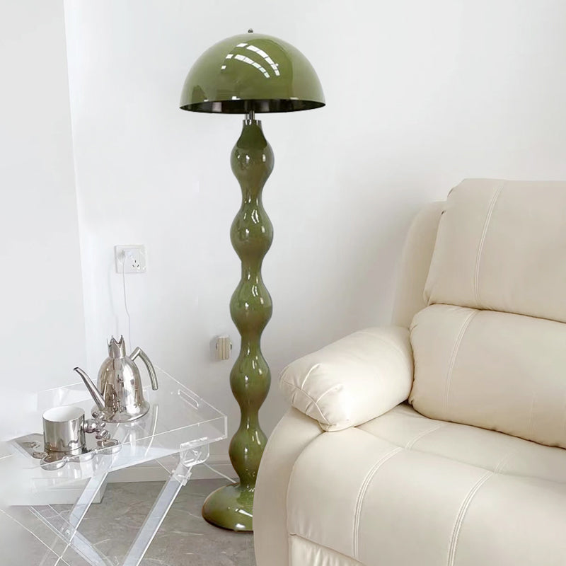 Contemporary minimalist LED mushroom floor lamp in a cozy living room corner.