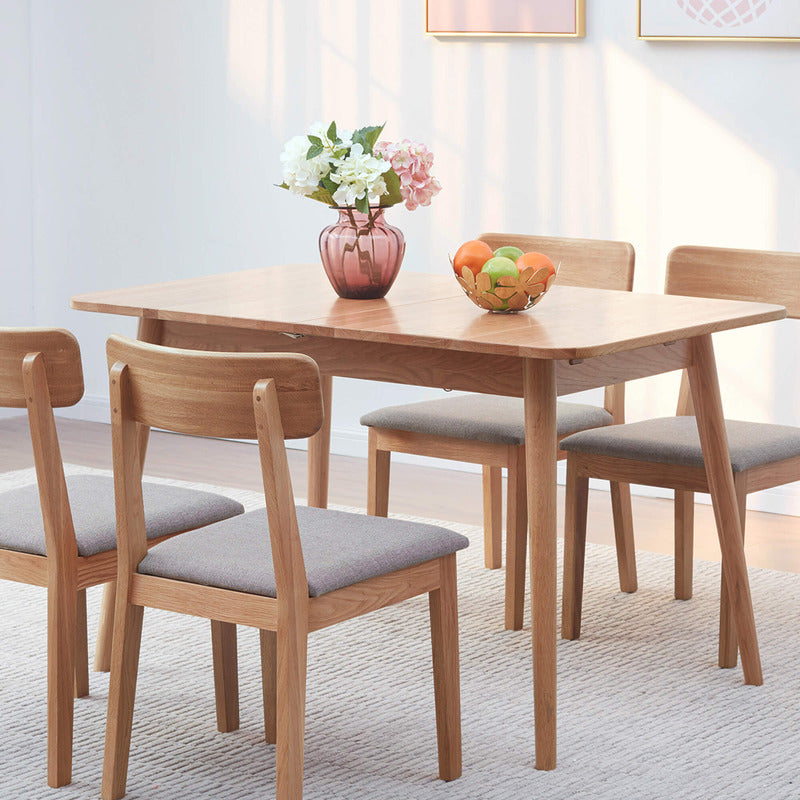 Elegant oak dining table showcasing its smooth finish and round edges