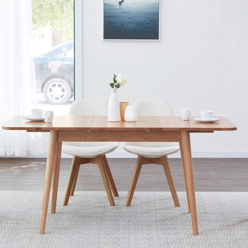Elegant oak dining table showcasing its smooth finish and round edges