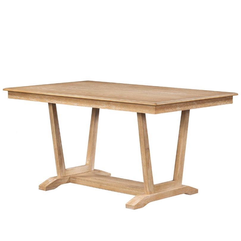 Close-up of the rectangular dining table with trestle base showcasing its natural finish.