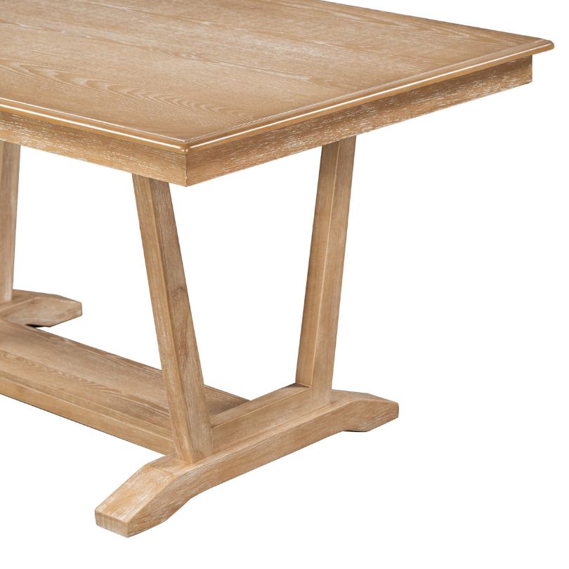 Four comfortable chairs surrounding the rustic dining table, perfect for family gatherings.