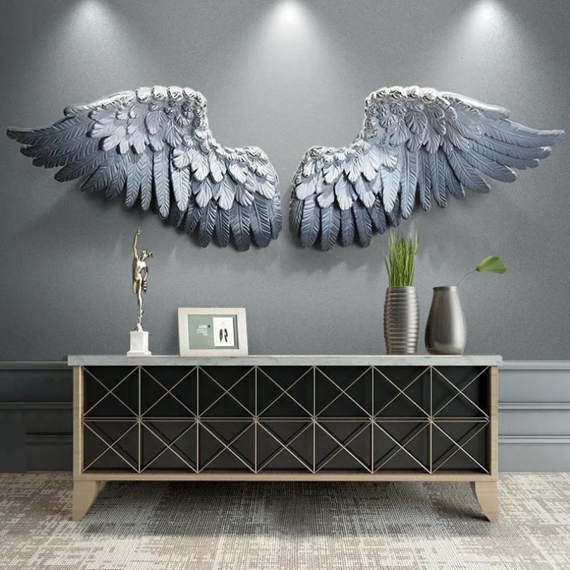 Close-up of Nordic 3D Feather Wall Art in a cozy living room setting, highlighting the vibrant blue color.